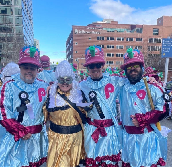 Parade go-ers wearing custom foam party hats