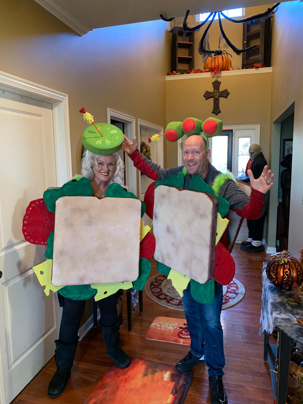 Two people wearing full-body foam sandwich costumes