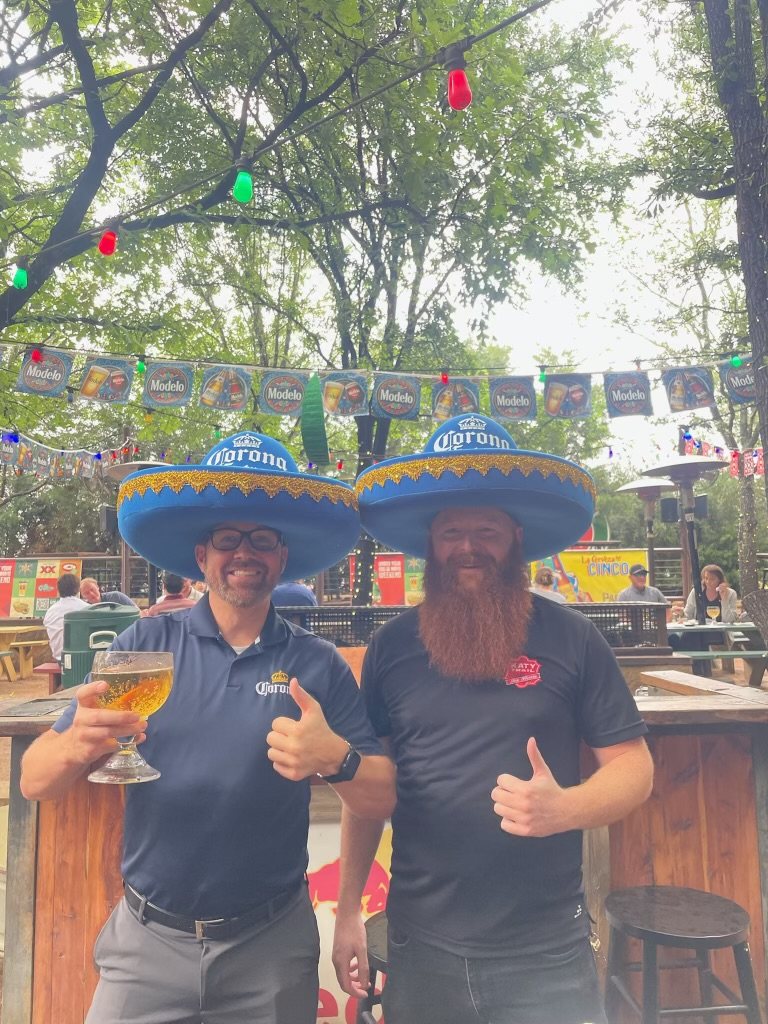 Corona brand ambassadors wearing custom foam charro hats at an outdoor event