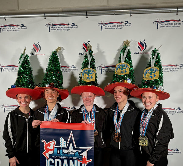 five people wearing custom foam tree hats