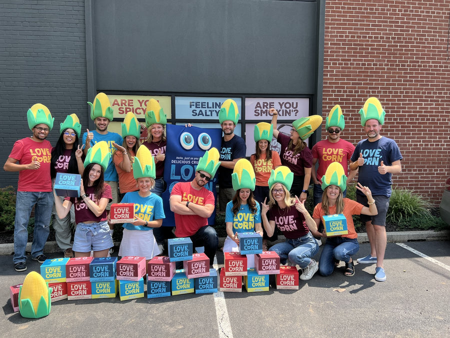 LOVE CORN team wearing custom foam corn hats at a brand event
